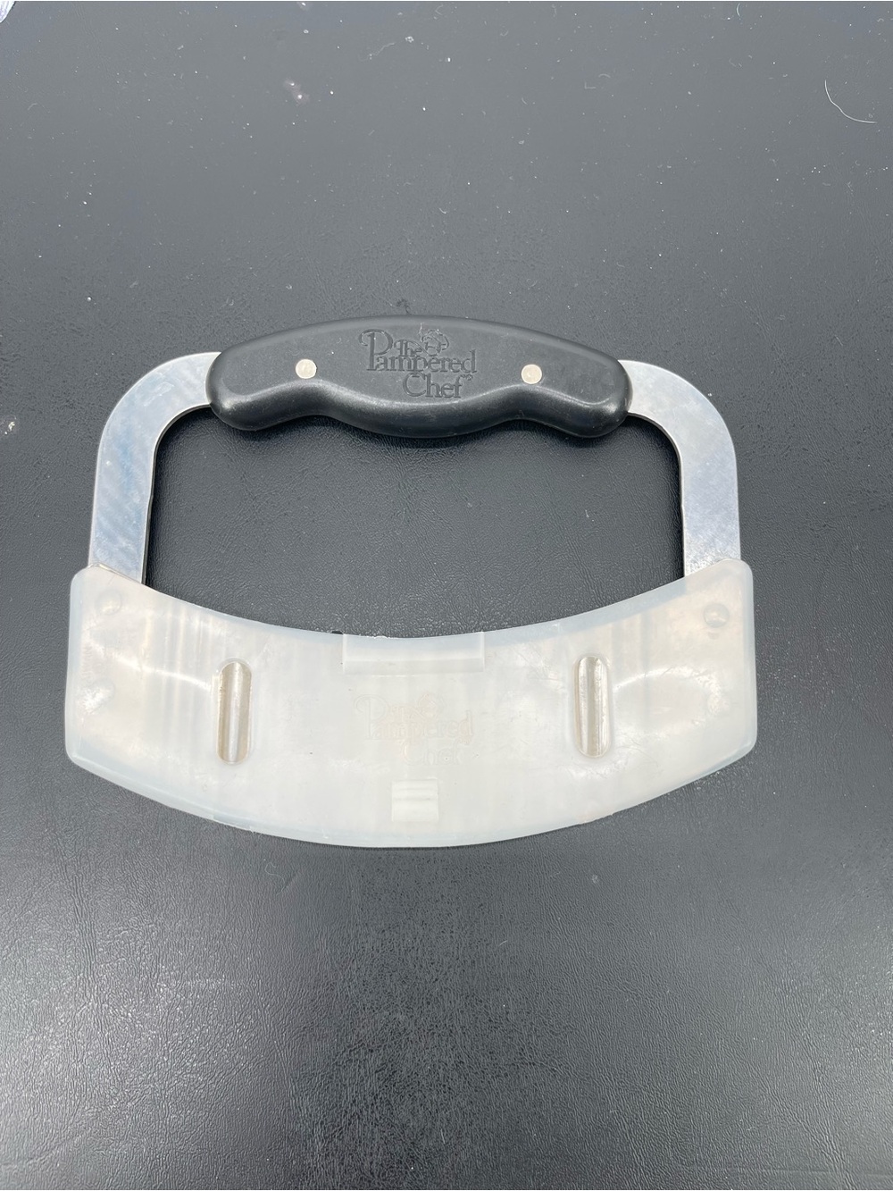 Pampered Chef Crinkle Cutter (#1063) used for creating decorative edges on food.